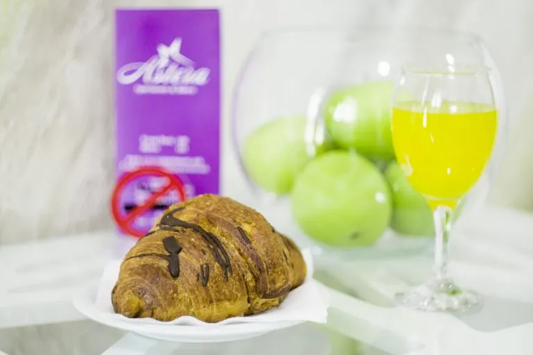 Chocolate croissant with fresh juice
