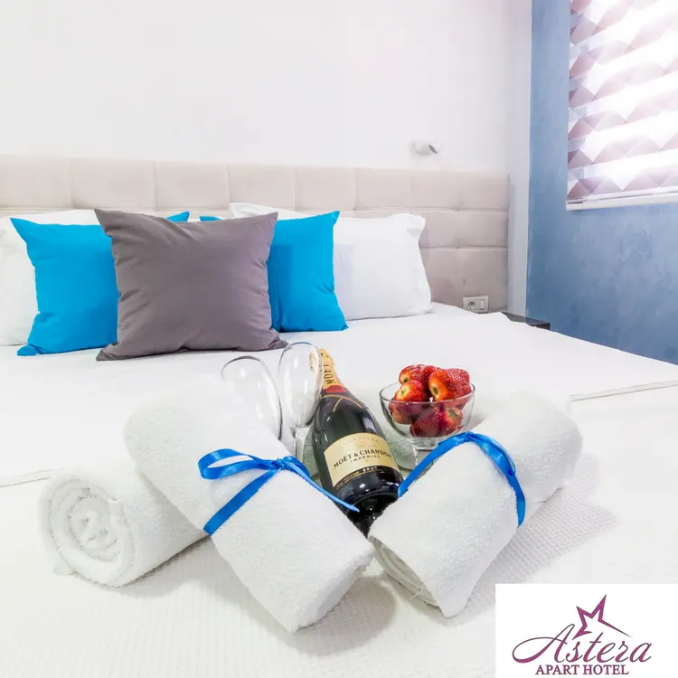 Bed prepared for guests in an Astera studio